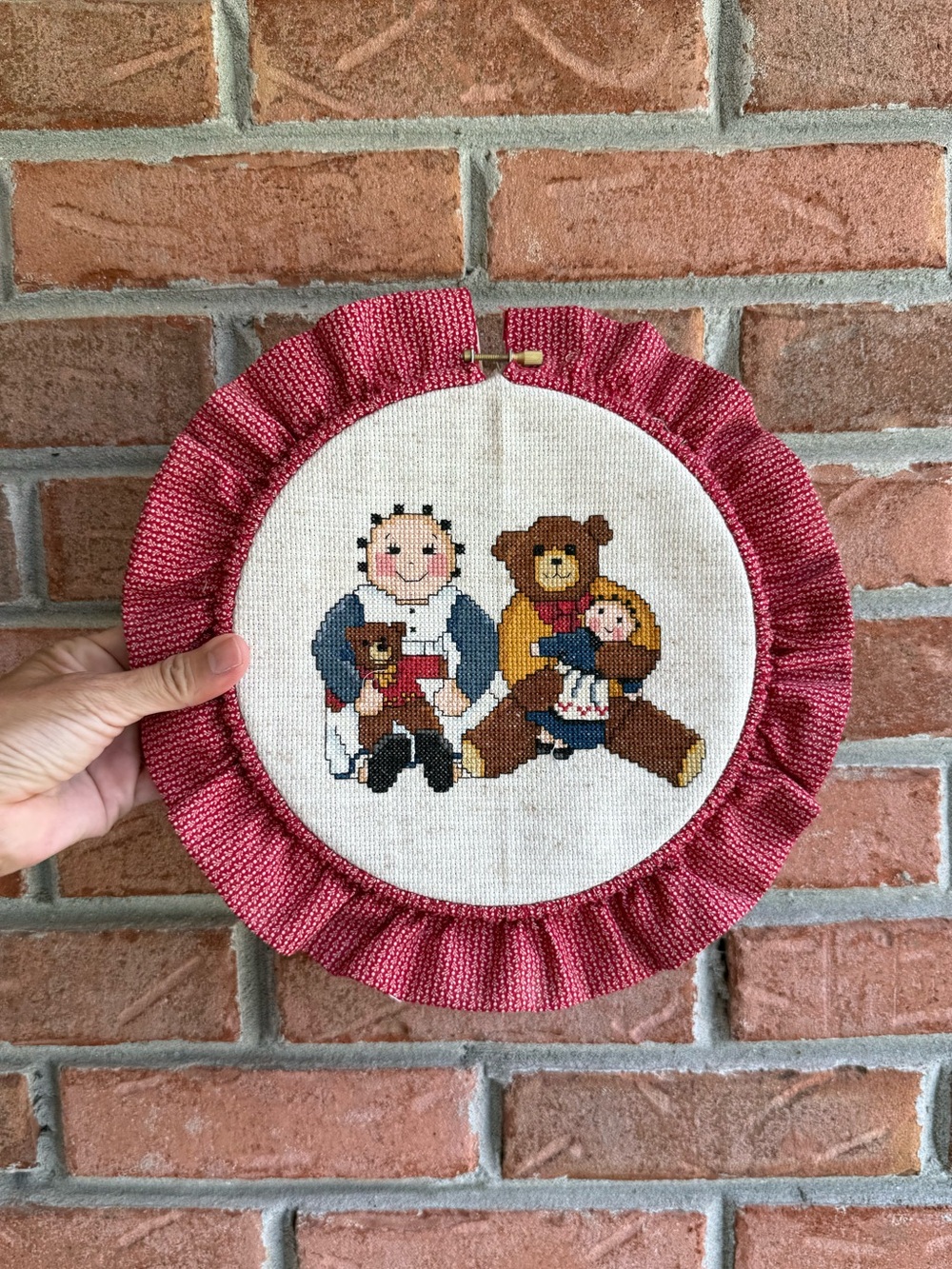 Vintage Grandmacore crossstitch bear and doll on hoop. Wall hanging.